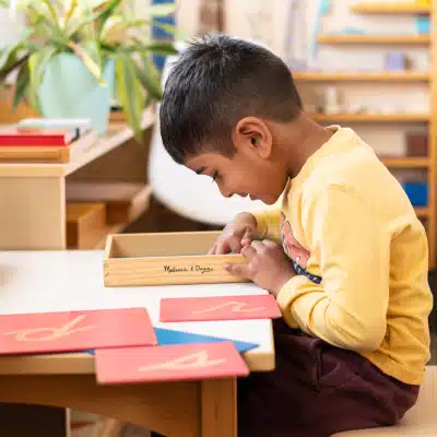 Montessori Boy Working at Desk