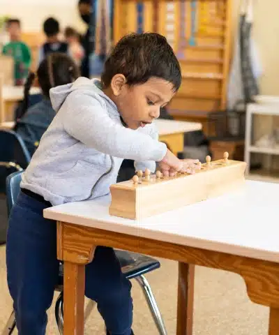 Montessori Boy Working at Table