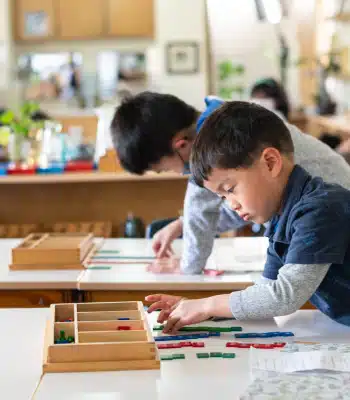 Montessori Boys Working On a Puzzle