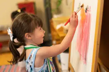 Montessori Girl Painting On an Easle