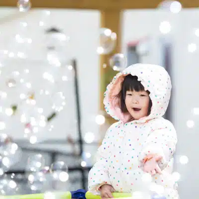 Montessori Girl Playing With Bubbles