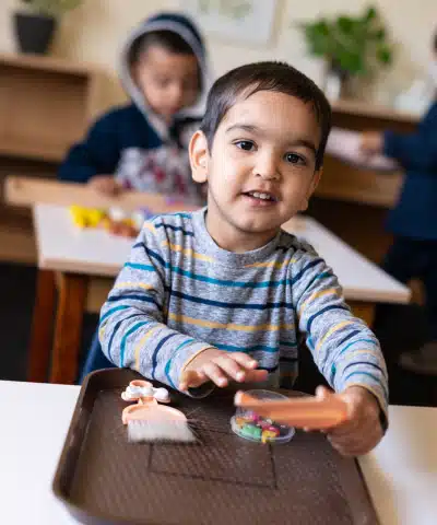 Montessori Toddler at His Desk
