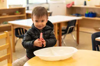 Montessori Toddler Smiling With a Sponge